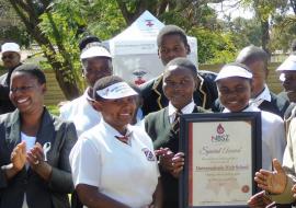 Students from the winning school pose with their award