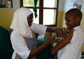 Grace receiving her second dose of HPV vaccine