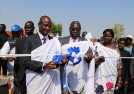 H.E Gen Taban Deng Gai cuts the ribbon during the opening of the IDU