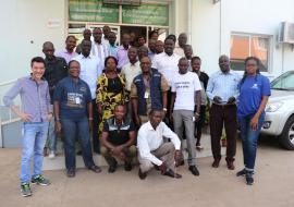 Participants in a group photo with the facilitators