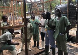 Psychologist team at the Butembo Ebola Treatment Centre meet in their office which was damaged in an arson attack earlier this year.