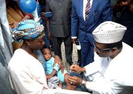 01 ED of NPHCDA administering vaccine to launch Meningitis A Conjugate Vaccine into Routine EPI Schedule.jpg