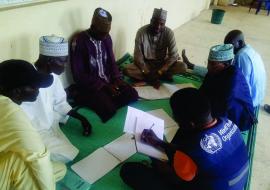 WHO supports health ambassadors in updating their registers after an immunization session at BHC Danfusan, Kiyawa LGA, Jigawa State