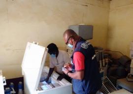 Health officers preparing the Measles vaccine before immunization in Aweil