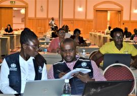 Mr. Hilary Njenge with Ms. Sarah Fordah, WHO Polio STOP consultant and COVID19 Data Mananger at a training of surveillance officers from all 14 regions in Windhoek 