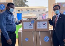 Dr. Desta Tiruneh handing over donated items to Hon. Ahmadou Lamin Samateh