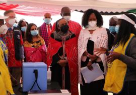 A health worker speaks to MOH and UN officials at the launch of measles rubella campaign in Kajiado county. Almost  4 million children are targeted