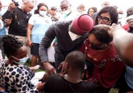 The Deputy Governor, Ude Oko Chukwu administering the vaccine to a child during the flag-off