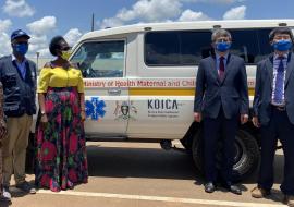 Left to Right: WHO Representative Dr Yonas Tegegn Woldemariam, Minister of Health in charge of Primary Health Care Hon Margaret Muhanga, Korean Ambassador to Uganda H.E Ha Byung-Kyoo and KOICA Director Mr Kim Taeyoung stand next to one of the seven ambulances given to Kamuli hospital from the project.