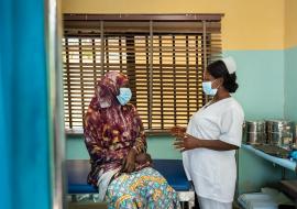 Nurse Peace (right) counsels a patient before she gets screened for cervical cancer at the RAiSE Foundation office in Niger State on 24 February 2021.