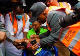 The WHO Country Representative administering a dose of Rotavirus Vaccine