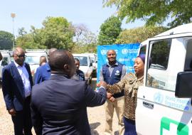 Hon. Minister for Health receiving keys for one of the vehicles donated by WHO