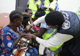 Dr Mutale Senkwe of WHO administering vitamin A during the African Vaccination Week Celebration