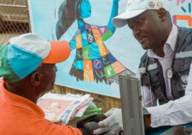 A staff checking blood pressure of a beneficary at the WHO at 75 free medical outreach in Osogbo