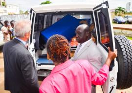 Dr Clement shows the German Ambassador and Minister of Health the equipped ambulance and first ost of spare parts