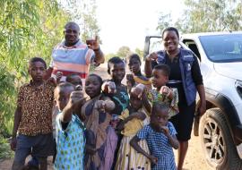 Vaccinated children showing off their marked figures