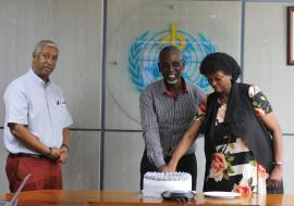 Dr. Yonas Tegegn, WHO Representative to Uganda (far left) at the service end of Mrs. Elizabeth Malinga, and Mr. Collins Mwesigye, WHO Climate Change Officer.