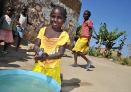 Child practicing washing hand.