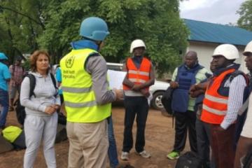 Mr Sylvain Paul Denarie briefing the WHO team on the arrangements for evacuations