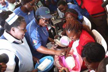 Zambia’s First Lady, Mrs Esther Lungu administers oral polio vaccine to a baby at the AVW regional launch in Lusaka