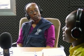 Zainab Akiwumi in the radio studio of Radio Maria talking about the need to suspend cultural and traditional practices in times of Ebola, Sierra Leone. WHO/S. Saporito