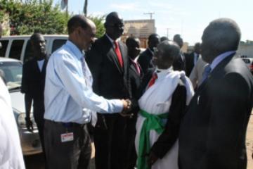 The Vice-President of the Republic of South Sudan, The Right Honourable Wani Igga, shakes the hand of the WHO Country Representative, Dr Abdi Aden Mohamed at New York Hotel in Juba. Looking on is the Minster of Health, Republic of South Sudan Honourable Reik Gai Kok photo: WHO/P,Ajello