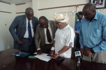 Deputy Governor of Osun State, reviewing the list of LGAs with un-immunized children with Dr Famiyesin WHO SW Zonal Coordinator, PS MOH and Mr Charles Korir.