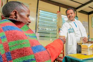 A health worker gives medication to a patient.  Kenya has embarked on a extensive evidence-based approach to root out TB 