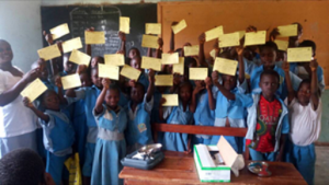 Primary school pupils of Eleyin in Isanlu, Isin LGA of Kwara state displaying their YF vaccination card