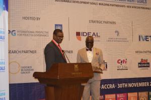 Dr Kaluwa presenting the award to  Dr Anyah