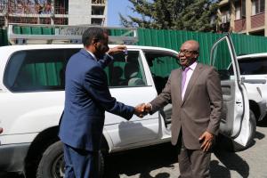 L to R Minister holding key in hands after receiving the key from WHO Representative to Ethiopia 