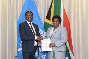 Dr Owen Kaluwa, the World Health Organization Representative in South Africa presenting his credentials to the Deputy Minister of International Relations and Cooperation, Ms Candith Mashego-Dlamini.