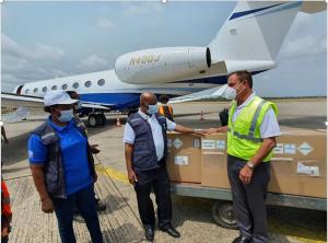 The Piolot of Johnson & Johnson Flight that brought in first batch of the EVD vaccine formally hading over the consignment to the WHO Representative in Sierra Leone at the Lungi International Airport 