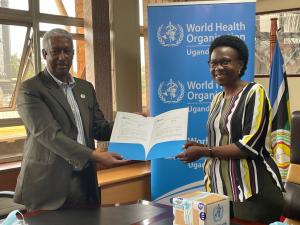 WHO Representative to Uganda, Dr Yonas Tegegn Woldemariam handing over 2400 mpox tests to the Minister of Health Hon Dr Jane Ruth Aceng Acero.