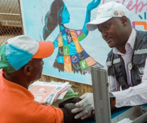 A staff checking blood pressure of a beneficary at the WHO at 75 free medical outreach in Osogbo