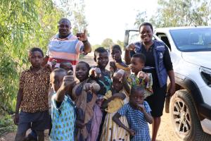 Vaccinated children showing off their marked figures