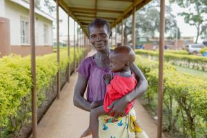 A mother with a child that is going through nutrition therapy in Koboko district 