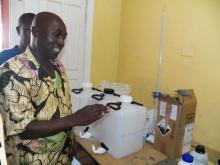 A health worker using the handrub as an IPC measure before and after clinical procedures at Bomi hospital