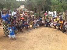 Mothers lining up with their children for immunization