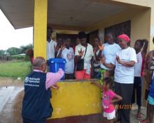 Prof.  Davison Munodawafa demonstrating hand-washing at the Deaf and Dumb School in Virginia, Montserrado