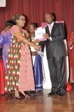 Cabinet Secretary James Macharia hands over the FCTC publication to Burundi Minister Dr Sabine Ntakarutimana to celebrate Africa’s decade implementation of tobacco control