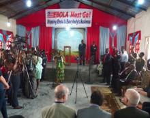 President Sirleaf and entourage entered the Christ Kingdom Harvest Church, where the program was held. At the far end, the President was washing her hands in 0,05% chlorine solution. 