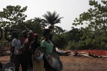 Women constructing treatment site.