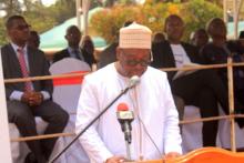 Prof. JM Dangou and the Minority Leader of the National Assembly displaying the award