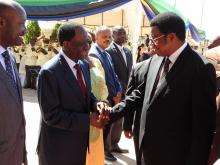 Hon. Kassim M. Maliwa (MP), the Prime Minister greeting the WHO Representaive, Dr. Matthieu Kamwa.