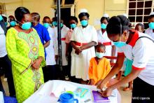 A young boy receives TB drugs at Arua Hospital 