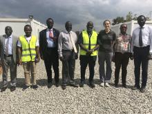 Honourable Dr Riek Gai Kok and his tem, Dr Olu and partners posing for a group photo during the visit of the ETU