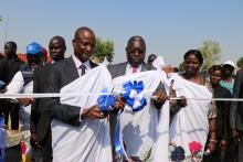 H.E Gen Taban Deng Gai cuts the ribbon during the opening of the IDU