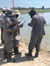 Participants conducting a practical session during the refresher training 