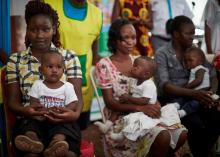 Elan, the first child to receive malaria vaccination and his mom Noreen, left, alongside other children who have received the vaccine